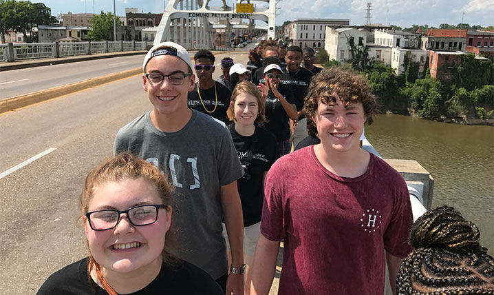 Students walk across the Edmund Pettus Bridge in Selma Alabama