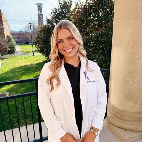 Successful student graduating from Lipscomb's ABSN program