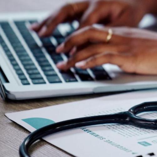 Doctor's hands typing
