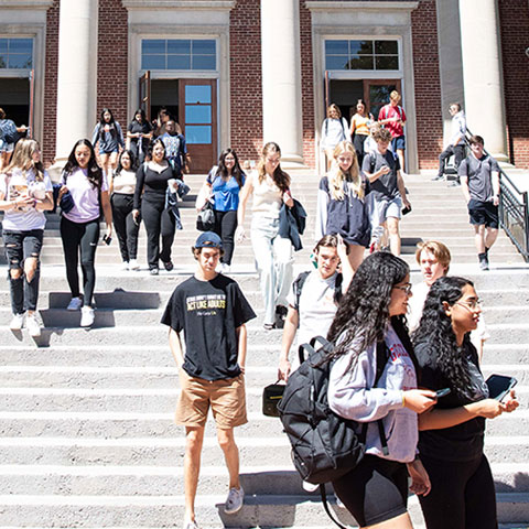 Students walking down steps at Collins Alumni Auditorium