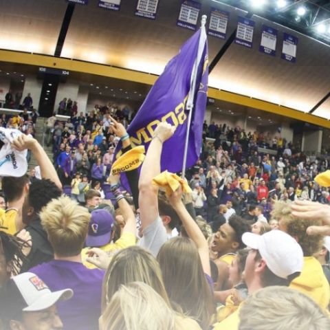 Students rushing the court after a basketball game win