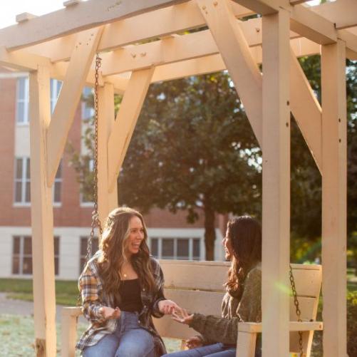 students sitting together outside