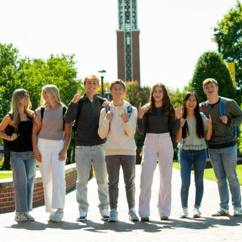 Students in front of the campus bell tower