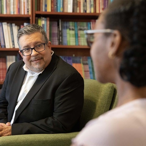 Therapist talks to client in a cozy setting