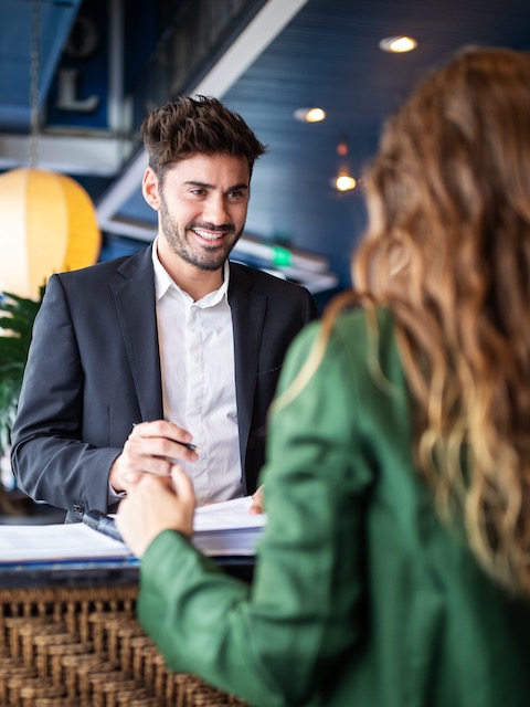 Hotel manager speaking with client