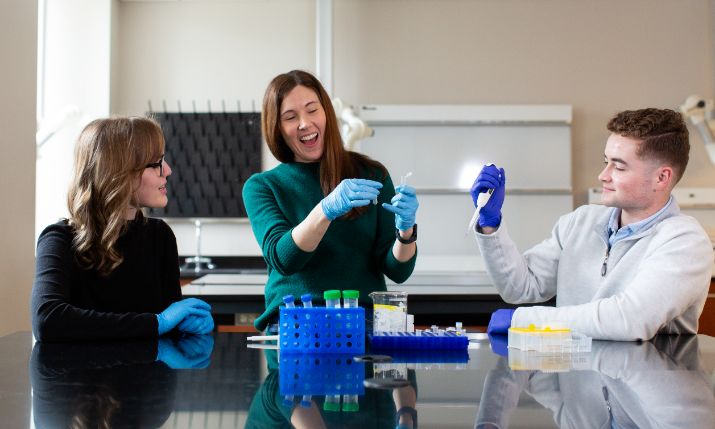 Professor in lab with students