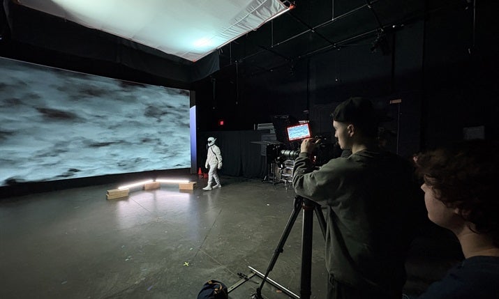 Behind the scenes look at an actor working in front of a volume wall