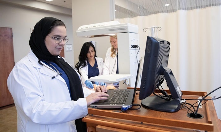 nursing student works at computer