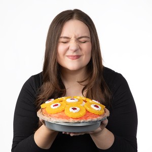 Marlee Shelton sniffing the goodness from one of her prop pies