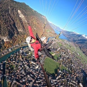 student Gavin Cavender paragliding in Switzerland