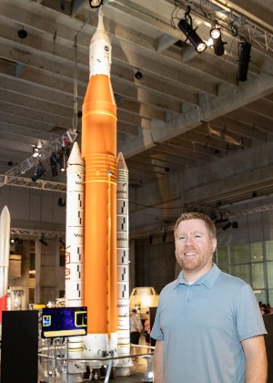 James Savage with model of the SLS at the U.S. Space and Rocket Center