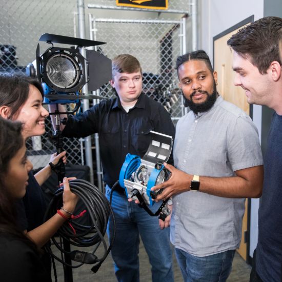 students with film equipment