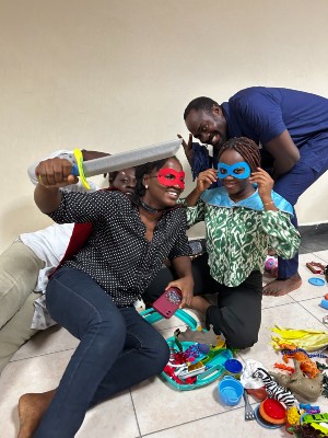 Workshop participants at play with the toys in the play therapy kit.
