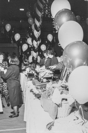 A balloon-decked registration booth for a reunion in 1995
