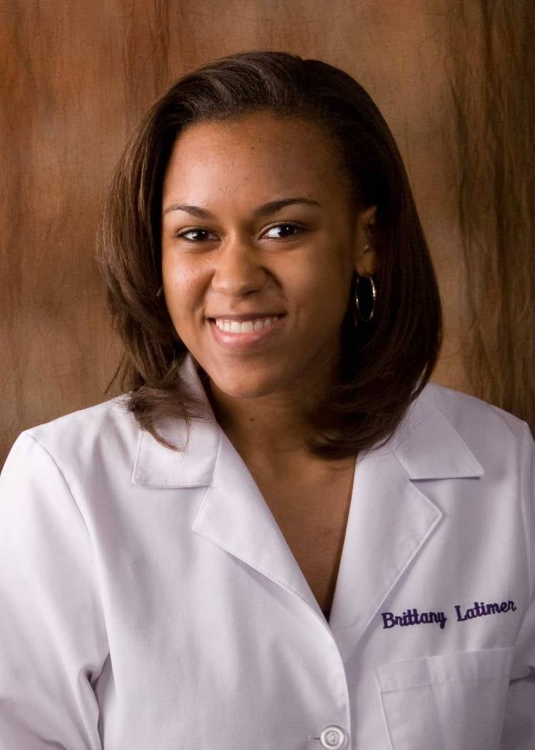 Brittany Latimer in her white coat
