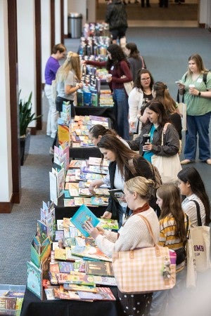 Teachers at the give-away book table