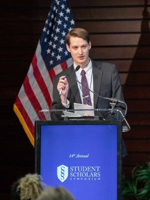 Josh Owens speaking at Faculty Research Day