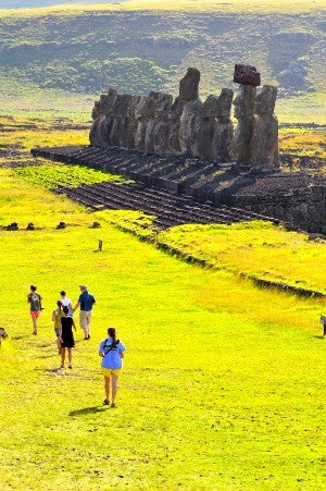 students exploring the ancient moai statues on Easter Island.