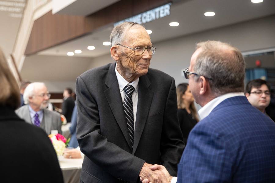 Dr. Paul Langford greeting guests