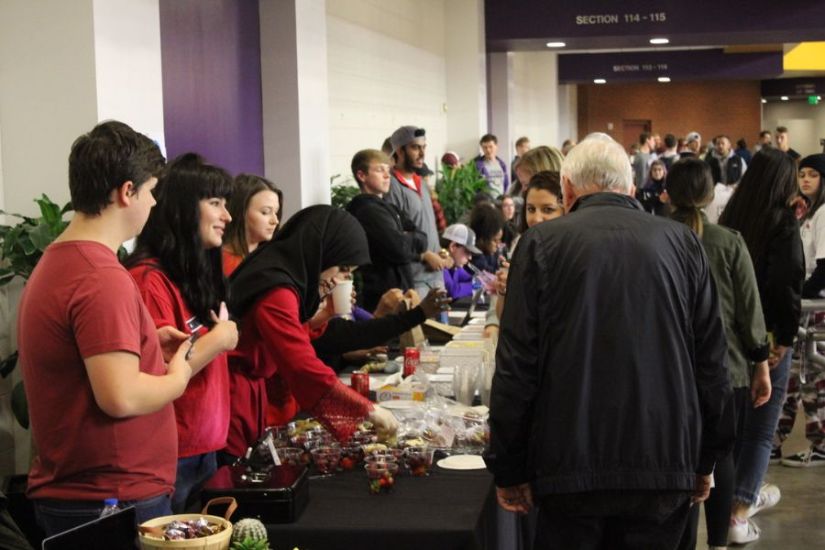 Student entrepreneurs sell their products in allen arena