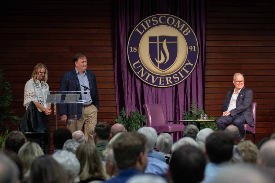 The College of Business's Allison Duke, left, senior associate dean, and Bart Liddle, associate professor of management, pay tribute to their colleague Joe Ivey. 