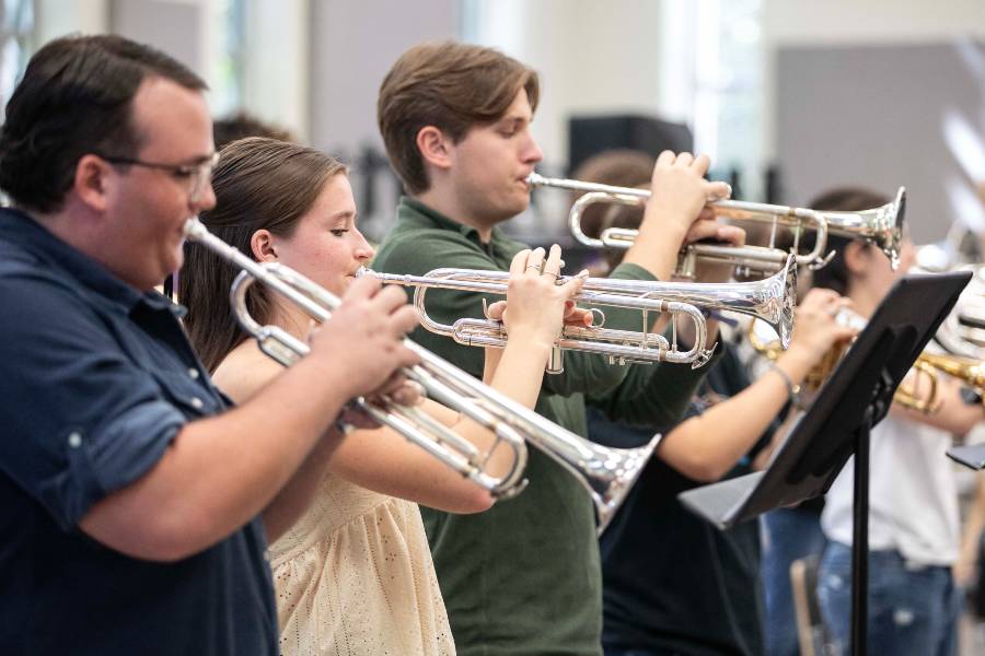 Pep Band trumpeters rehearsing. 