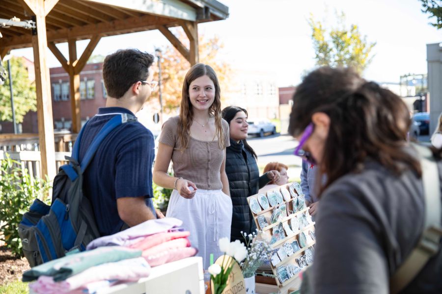 students showing their business