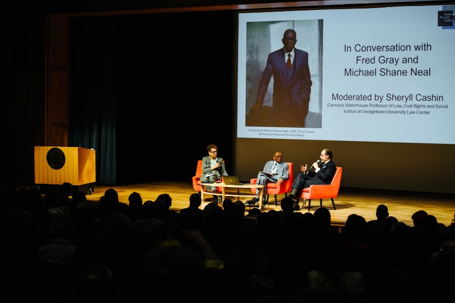 Michael Shane Neal and Fred Gray on the stage at the Smithsonian panel discussion