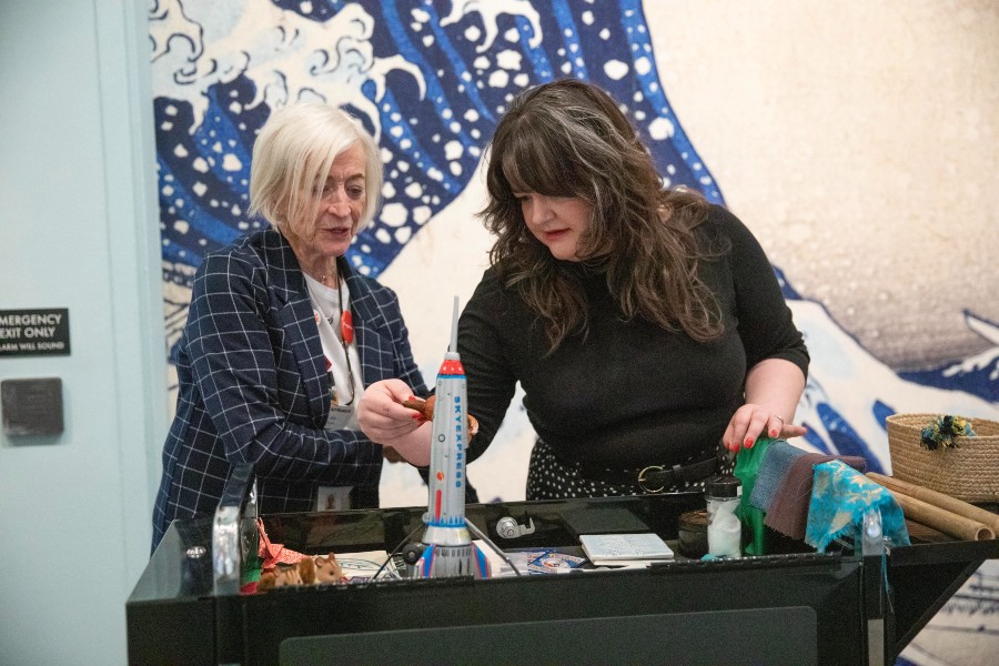 Meagan Rust working with a docent at a Multisensory Exploration Station