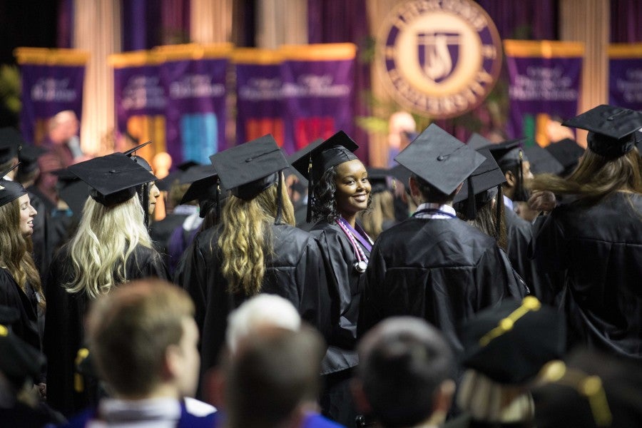 A graduate at commencement ceremony