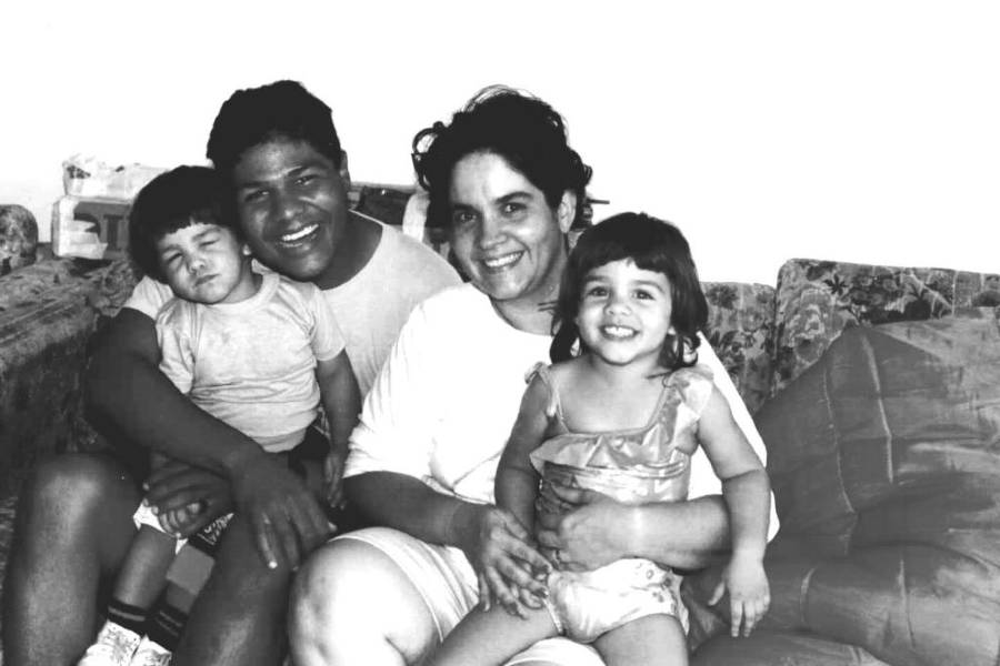 Carlos Santiago with his parents and sister, Rosabel. 