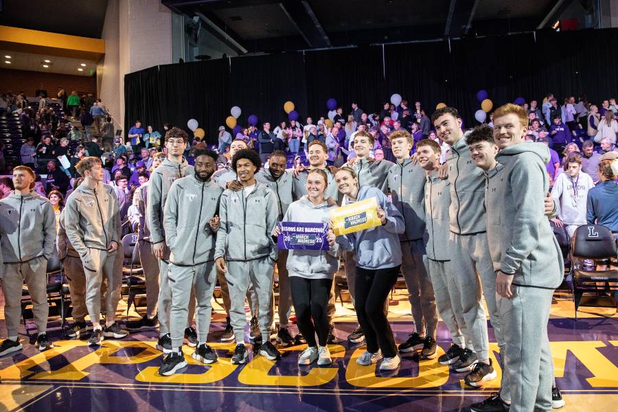 Fans pose with the team