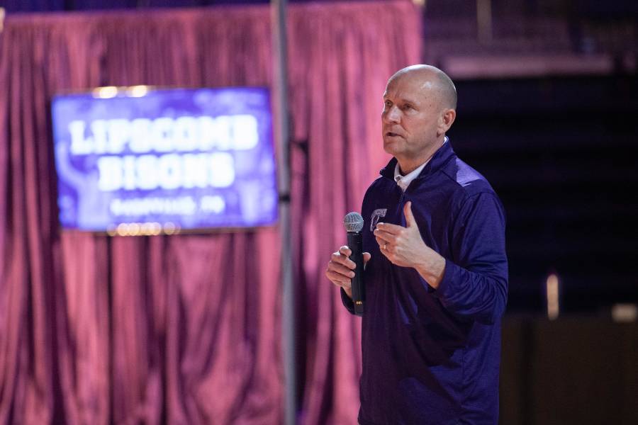 Coach Acuff addresses the crowd gathered for Selection Sunday watch party. 