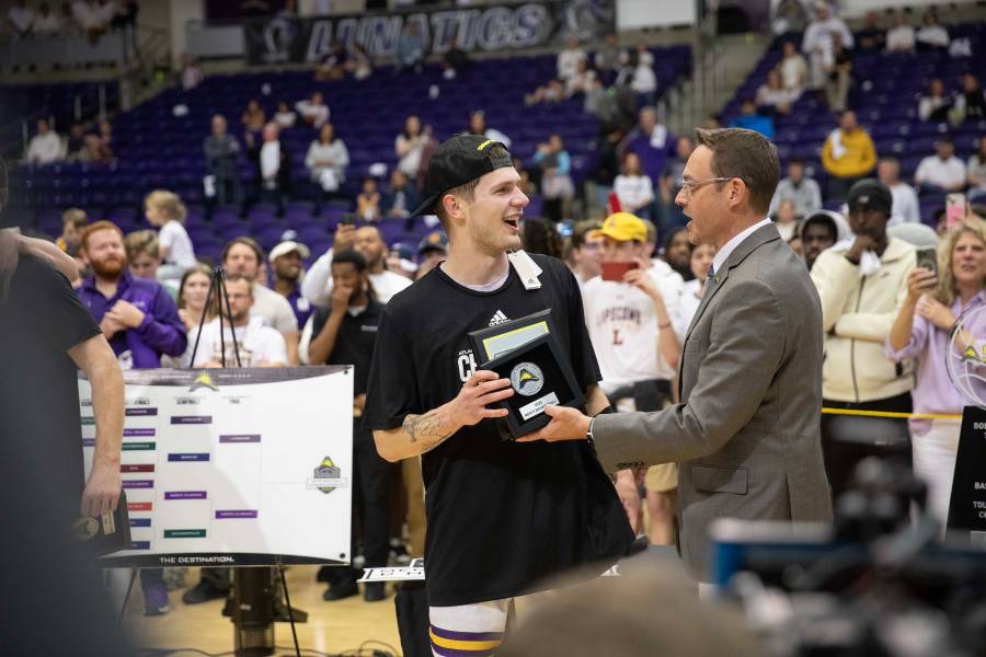 Joe Anderson accepts the ASUN tournament MVP trophy. 