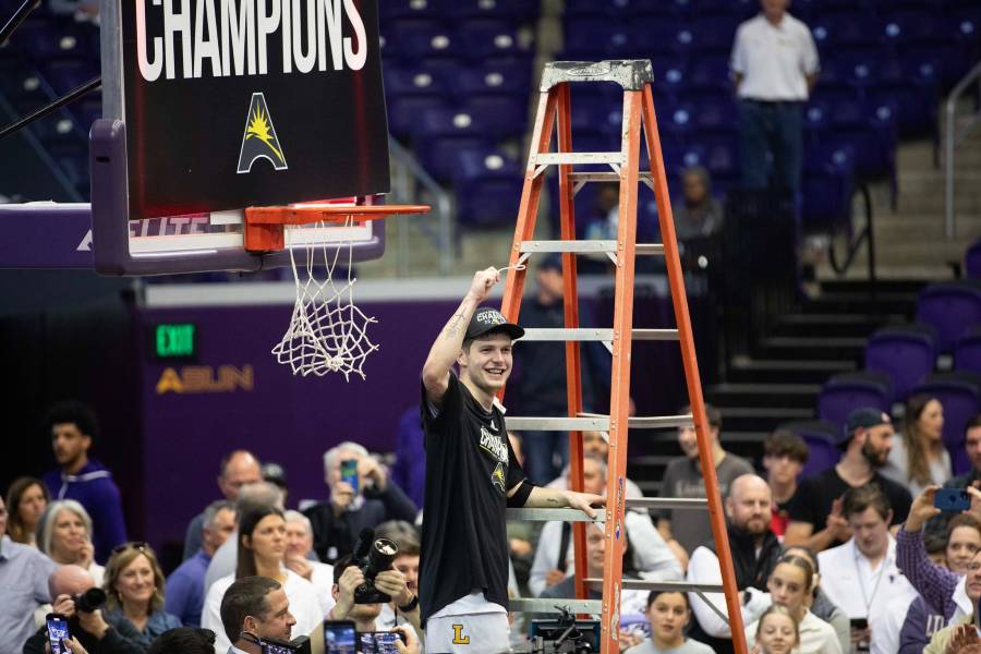 Anderson cuts down the net.