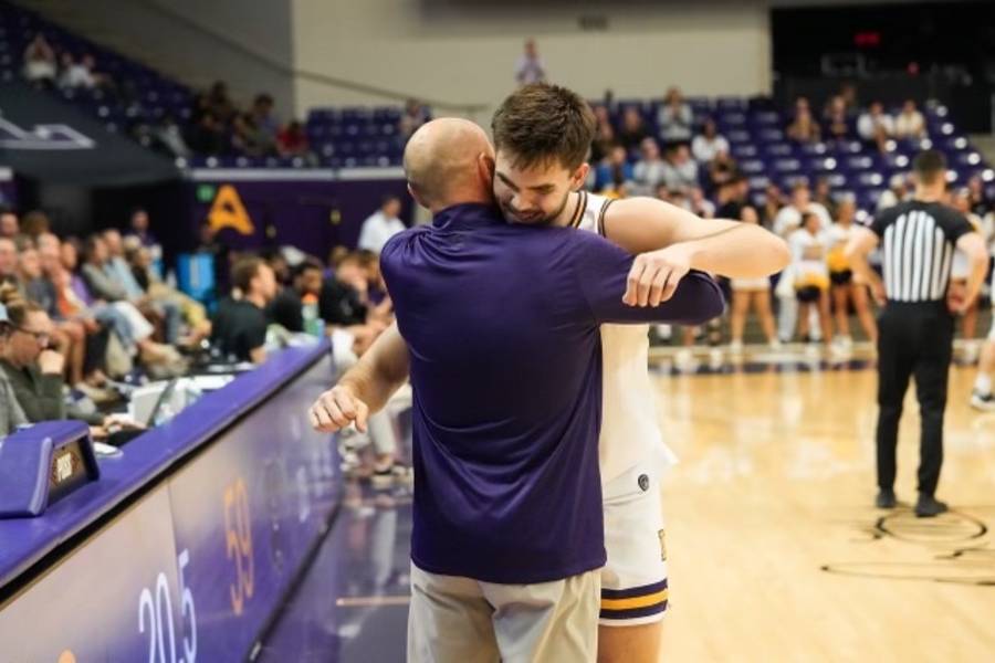 Jack Ingold hugs Lennie Acuff