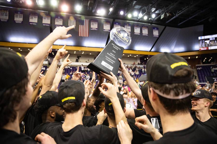 Team holding the ASUN trophy