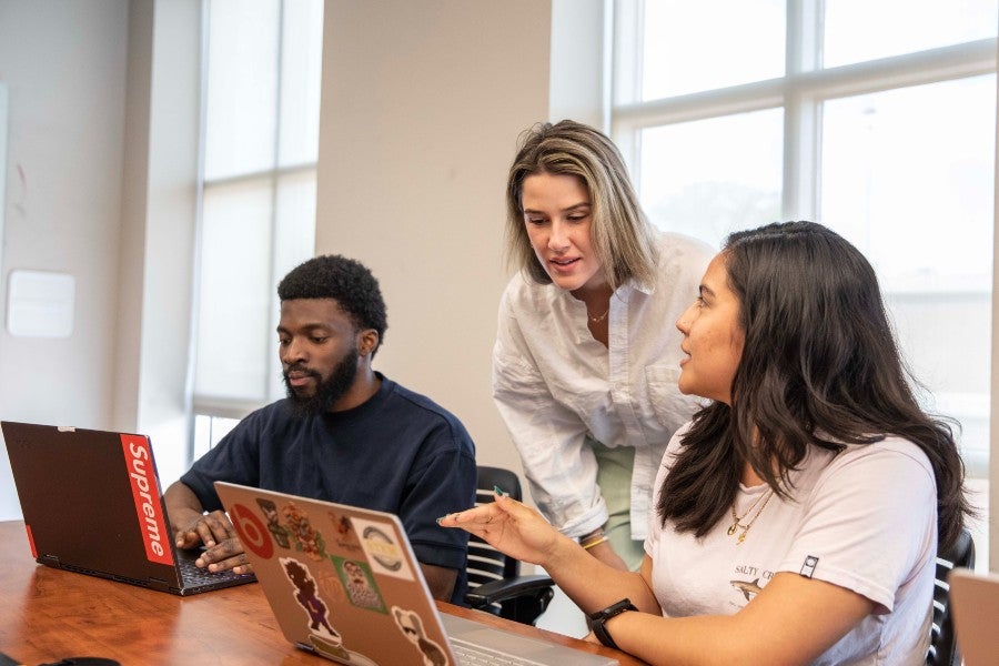 Computing students with Ella's House executive director Elise Jenkins