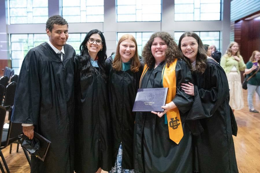 Group of students celebrating IDEAL program graduation.