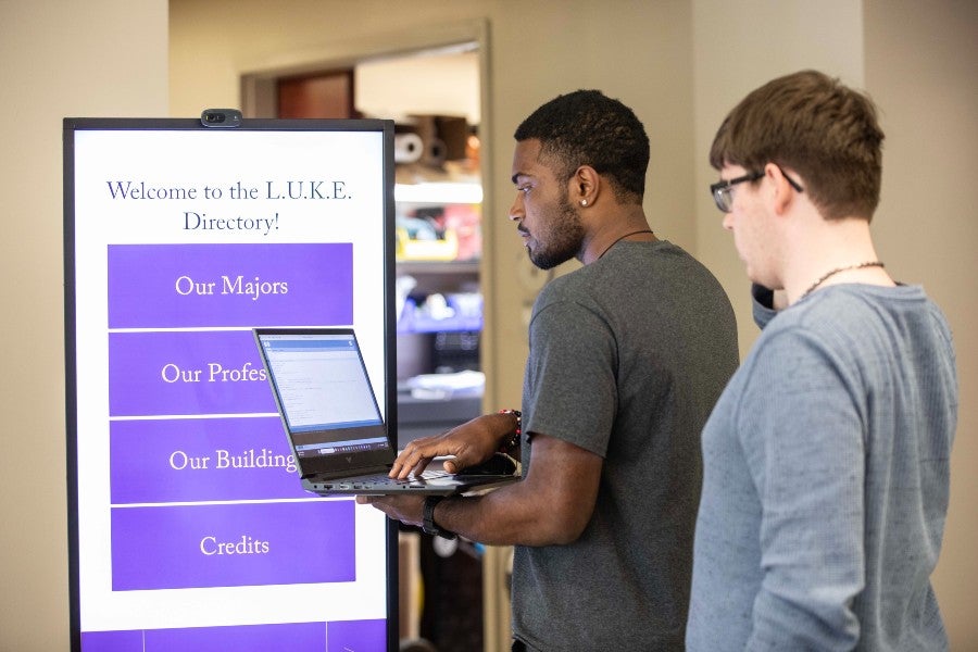 Students work on refining the L.U.K.E. kiosk