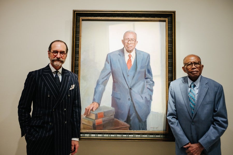 Michael Shane Neal (left) and Fred Gray (right) with Gray's portrait in the National Portrait Gallery. Photo by Matailong Du for the Smithsonian National Portrait Gallery.
