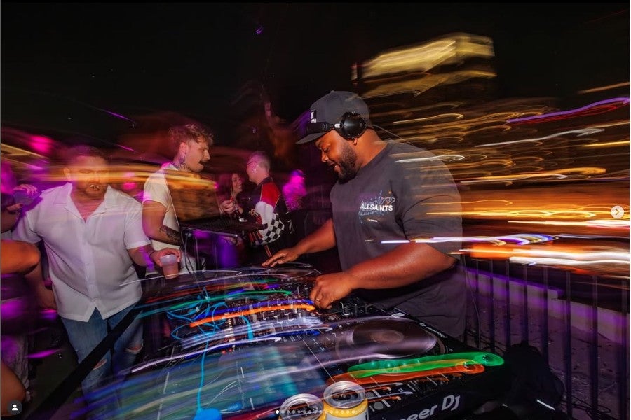 Jalen Anderson DJing at a venue