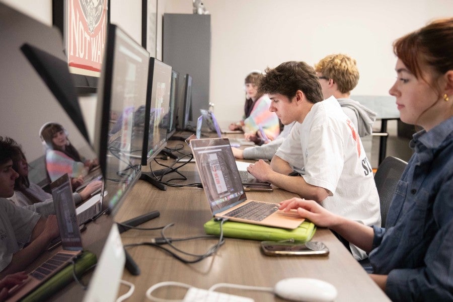 Students working in a graphic design class