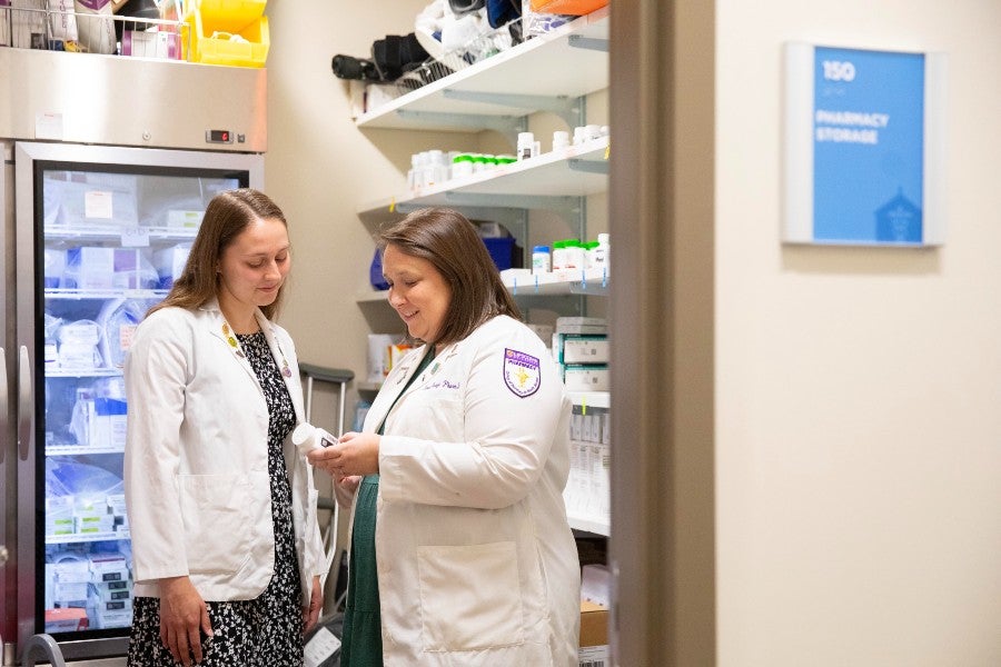 Lipscomb pharmacy graduate Mikayla Morrow with Sarah Uroza, Lipscomb pharmacy professor and on-site patient advocate at Faith Family