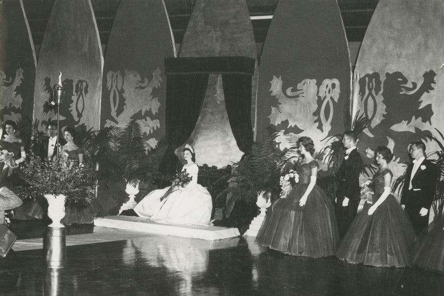 The 1960 Homecoming court posed before John Hutcheson's set fit for royalty.
