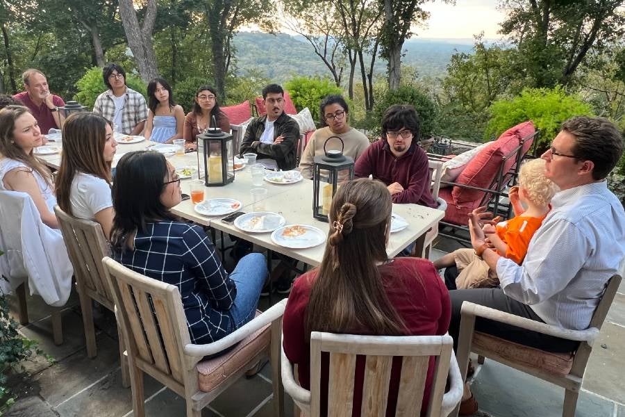 Science majors visit with Raye Mitchell and guest at the Mitchell's home