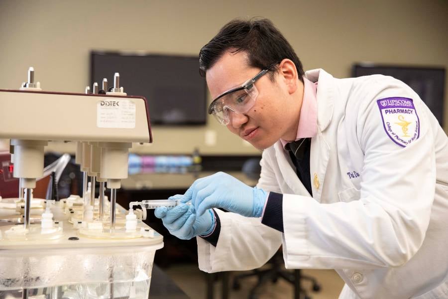 Student pharmacist at lab. 