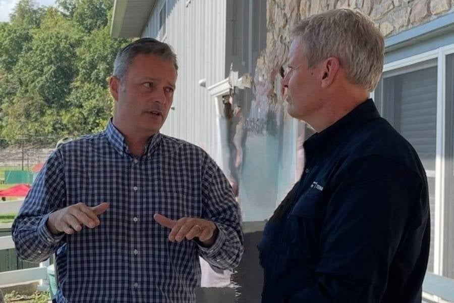 Rob Mathis (’24), left, meets with Tennessee Governor Bill Lee who toured Cocke County in the days following the catastrophic flooding. Photo courtesy: Rob Mathis