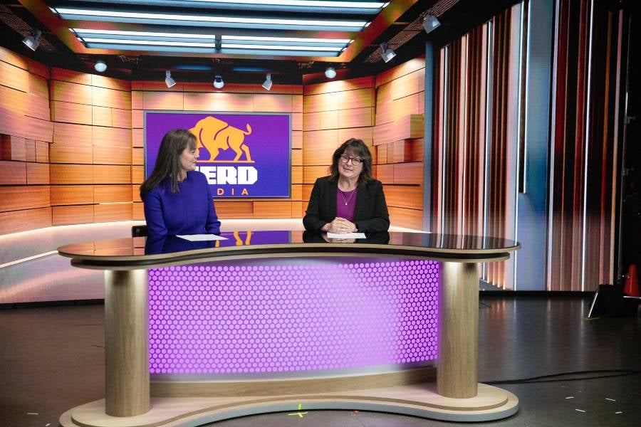 President McQueen and Provost Shewmaker demonstrate how to use the virtual production volume stage for a newscast.