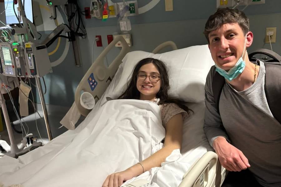 Chloe and Connor Butler in Chloe's hospital room. 